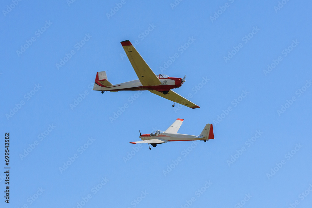 Small aircraft soaring through clear blue skies. Small aircraft soaring through clear blue skies.