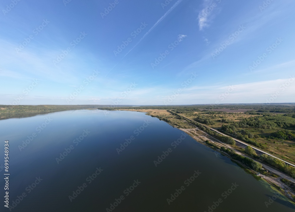 Landscape from a bird's eye view. The river goes beyond the horizon.