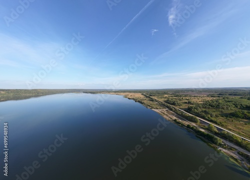 Landscape from a bird's eye view. The river goes beyond the horizon.