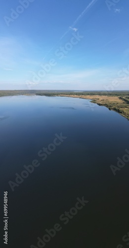 Wallpaper Mural On a sunny autumn day, the earth separates the sky and water. Torontodigital.ca