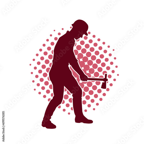 Silhouette of a worker in action pose using his axe tool.