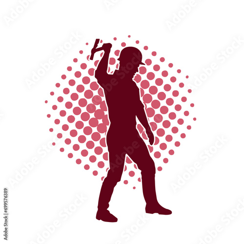 Silhouette of a worker in action pose using his axe tool.