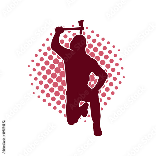 Silhouette of a worker in action pose using his axe tool.