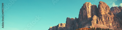 Obraz na płótnie Mountain landscape background. Rocks against the day sky. The Dolomites in South Tyrol Italy Europe. Horizontal banner w salonie