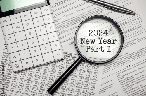 2024 NEW YEAR CHAPTER ONE word on magnifying glass with calculator and documents