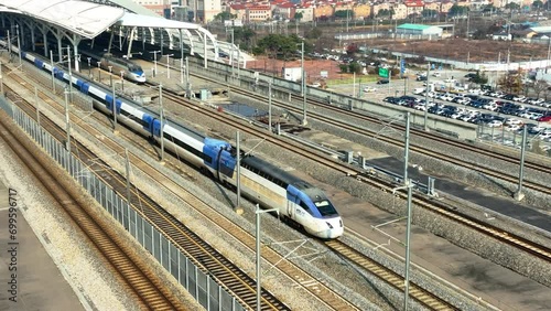 a high-speed train departing from a station,  KTX train in Korea, Osong station