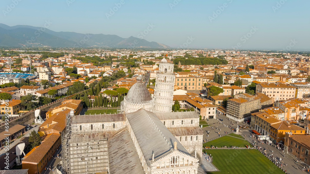 Pisa, Italy. The famous Leaning Tower and Pisa Cathedral in Piazza dei Miracoli. Summer. Evening hours, Aerial View