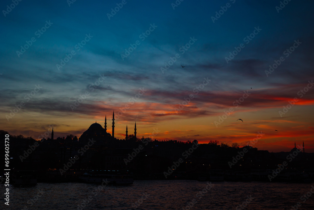 Silhouette of Istanbul with dramatic clouds at sunset. Suleymaniye Mosque
