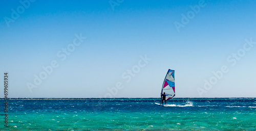 one surfer rides in the Red Sea in Egyp