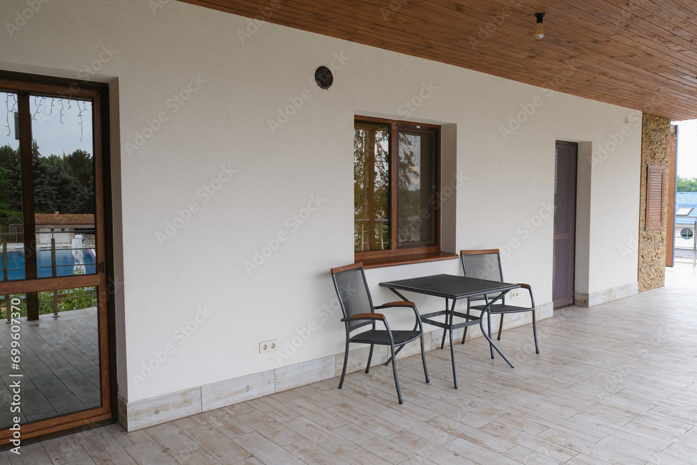 Fototapeta premium Balcony of a two-story cottage in a country complex.