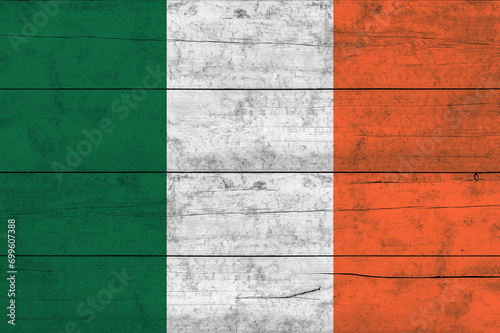 Ireland flag on a wooden surface. Banner of the grunge Ireland flag.