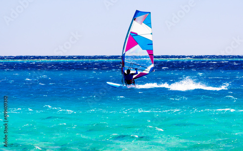 windsurfer rides on the waves of the Red Sea in Egypt Dahab South Sinai