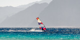 windsurfer rides on a background of high rocky mountains in Egypt Dahab South Sinai
