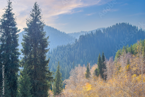 Experience the breathtaking beauty of autumn in the Tien Shan range. Immerse yourself in vibrant colors and stunning scenery. Be captivated by the contrasting palette of nature's orchestra.