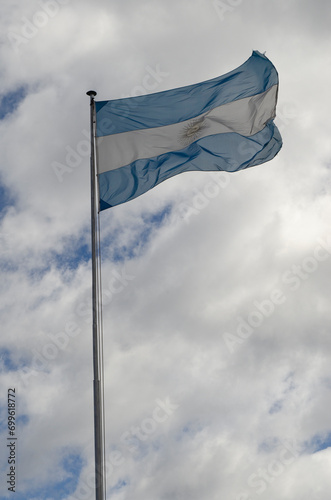 Argentine flag flying on cloudy day © Lautaro