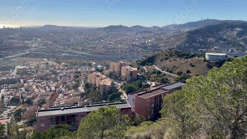 view from the top of the hill on the agglomeration of Barcelona and the surrounding countryside photo