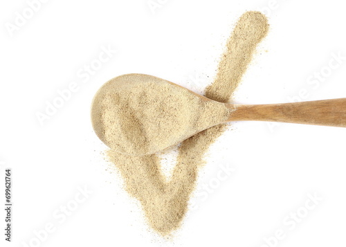 Milled white pepper powder pile in wooden spoon, peppercorn isolated on white background, top view