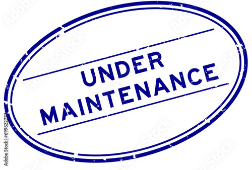 Grunge blue under maintenance word oval rubber seal stamp on white background