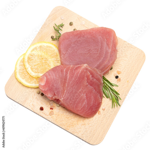 Fotografie Fresh tuna Fish steak on a wooden cutting serving board isolated