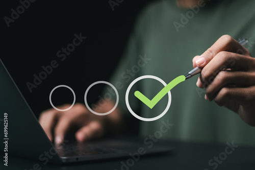 Businessman checking mark and takes online assessment survey test for approve quality assurance and ERP management, Quality management with assurance.