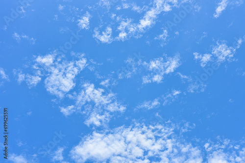 Blue sky and tiny white clouds for background.