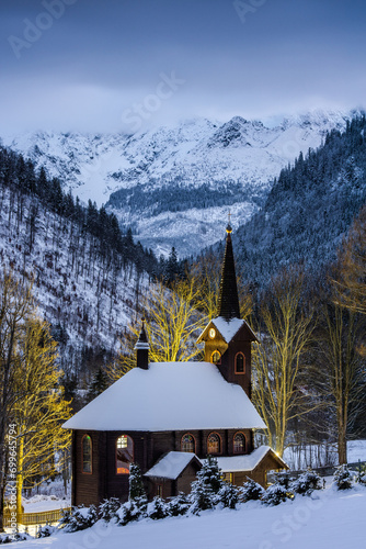  Church of St. Anne in Tatranska Javorina, Slovakia at night in winter scenery photo