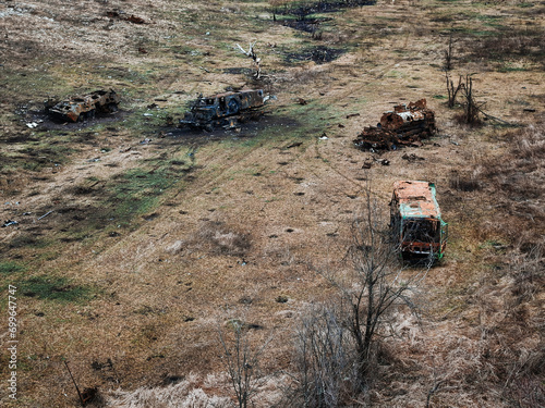 War in Ukraine, burned military equipment on the battlefield, view from a drone, bird's eye view
