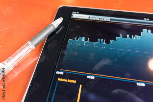 Stock graph with tablet photo