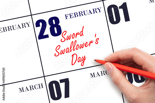 February 28. Hand writing text Sword Swallower's Day on calendar date. Save the date. photo