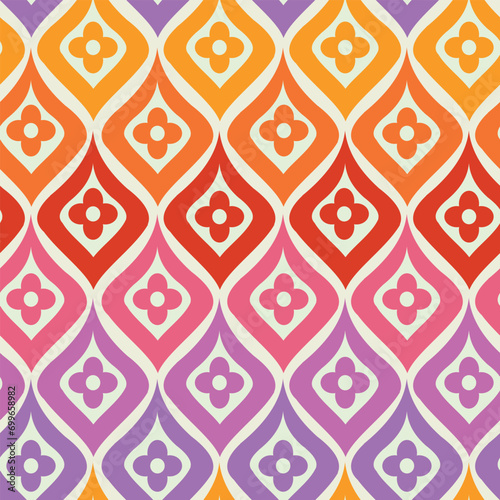 Retro Colorful flowers on mid century ogee seamless pattern in pink, purple, orange and red on white background. For home decor, textile and wallpaper 