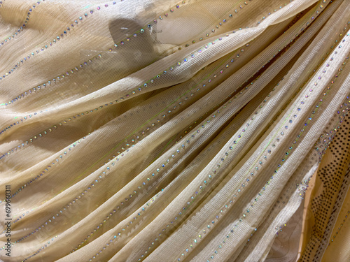 Close-up of cream color scarves , dupatta stola chunri , stola showing fabric and patterns used by ladies in clothing textile photo