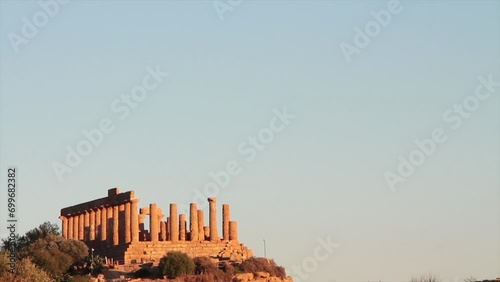agrigento sicily italy ancient temple of juno pillars on mountain top peak wide shot with sky above photo