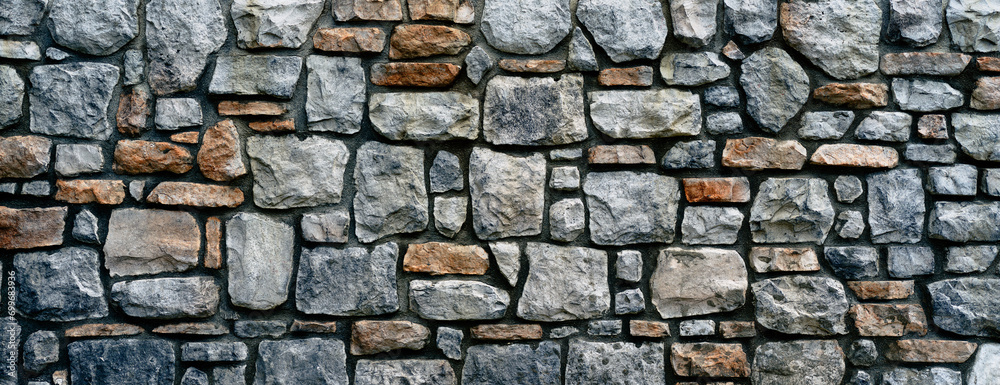 Natural stone wall with mortar close up background