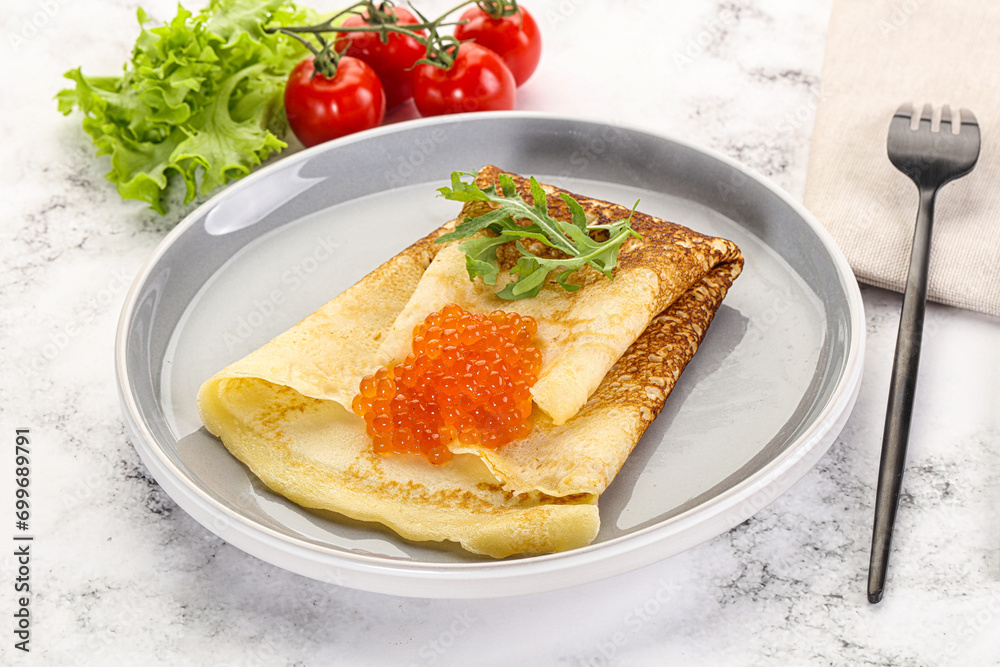 Russian pancake with red caviar Russian pancake with red caviar