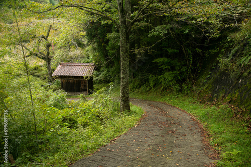 Walking the hiking road following the Nakasendo trail between Tsumago and Magome in Kiso Valley  Japan.