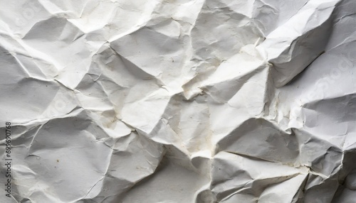 crumpled paper background,  a white blank crumpled paper texture, a surface that whispers tales of experience and resilience. offering an empty stage for the eloquence of your chosen text photo