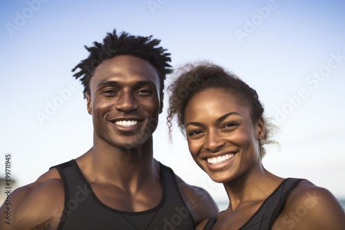 A man and a woman are posing for a picture