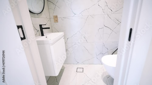 white bathroom vanity with black fixtures