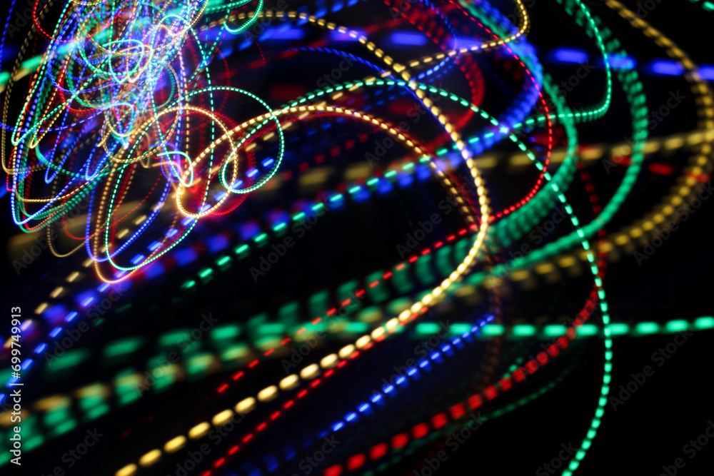 A photograph of vibrant multi-color lights in a long exposure photo. Light painting photography A photograph of vibrant multi-color lights in a long exposure photo. Light painting photography