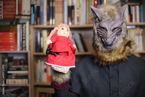 Wolf holding little red riding hood themed doll