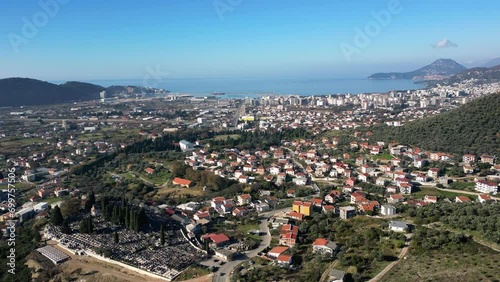 Bar, Montenegro. Panoramic drone shot of city buildings, sea and harbor photo