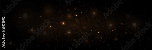 Gold dust light and glare particles. Magic light effect. Christmas glowing dust background. photo