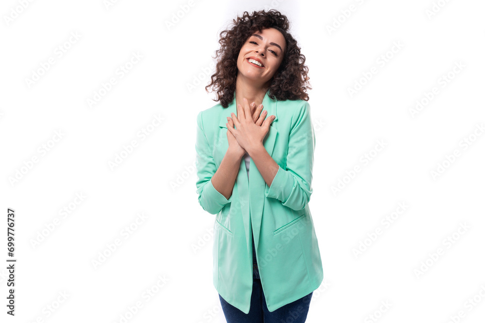 young pretty curly brunette employee of a business company woman stylishly dressed in a jacket on a white background