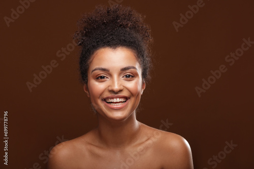 Beauty portrait of afro woman with amazing natural toothy smile . photo