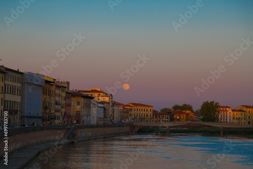Pisa s Twilight Serenade: Sunset Waters and Silhouetted Charm