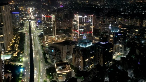 Aerial drone shot of twinkling city skyline