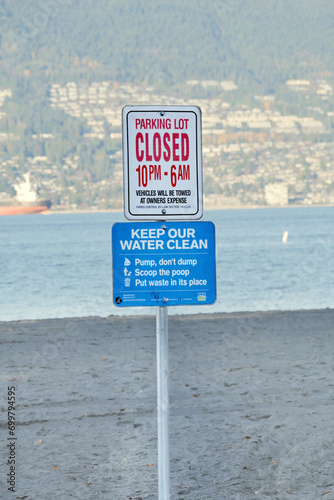 Parking Lot closing time and Clean Water signs at Jericho Beach in Vancouver, British Columbia, Canada photo