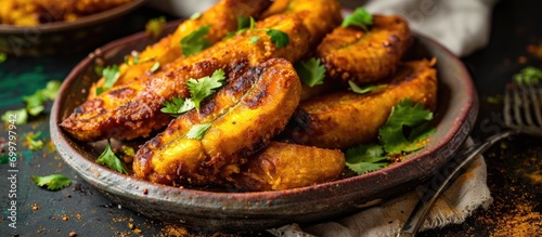 Indian-style fried bananas served on a plate, delicious and traditional. photo