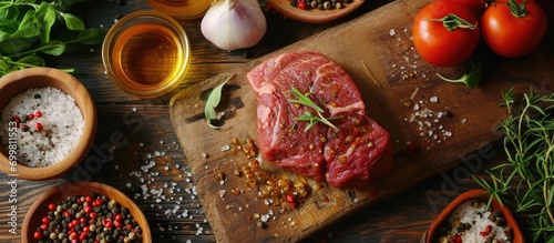 Wallpaper Mural Cook seasoning beef steak with various ingredients. Torontodigital.ca