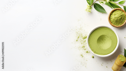 cup of green tea with matcha tea powder on light background